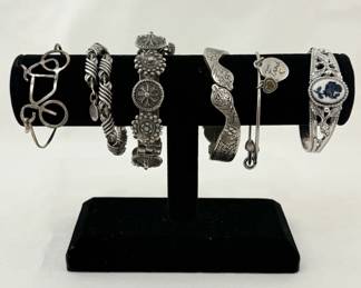 More silver bracelets including one by Alex and Ani, and a sterling silver serpent bracelet!