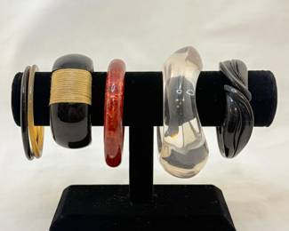 Lucite bangle bracelets and Bakelite bangle bracelets