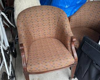 Set of four signed Baker Furniture Company tub style chairs on casters.