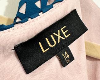 Closeup of Dorothy Perkins LUXE UK Size 14 teal & blush pink sleeveless midi pencil dress – blue cut-out dress with blush pink lining underneath