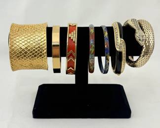 Beautiful bracelets from left to right: St. John, Money, Helm and Hahn Co., cloisonné bangles, Swarovski crystals, and a metal mesh wrap around serpent from Whiting & Davis