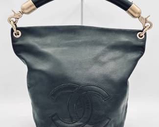 Vintage Chanel CC mark bucket black leather tote bag, authenticated by Entrupy.