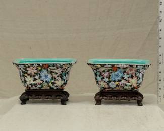 Another view of the pair of vintage Chinese porcelain famille rose mille fleur planters with carved wooden stands