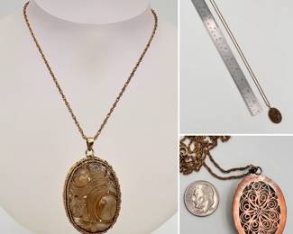 A carved stone pendant on chain necklace