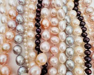 Closeup of the cultured pearl necklaces with 14k yellow gold clasps