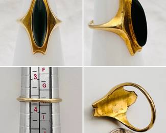 An antique ring with a nephrite jade elongated oval cabochon set in gold