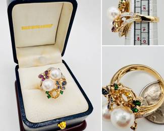 Lovely 18k yellow gold ring featuring a large pair of pearls with gem set butterflies and diamond accents