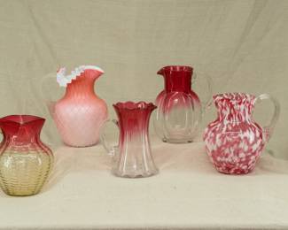 A collection of art glass pitchers in Amberina, Rubina, quilted peachblow MOP 