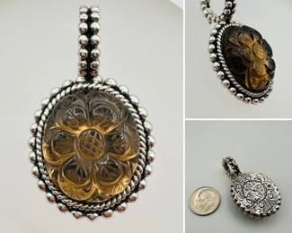 A beautiful carved flower form sterling brooch by Stephen Dweck