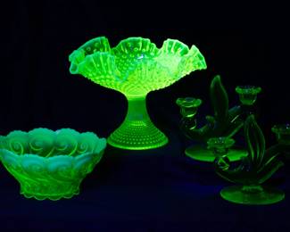 Seen under black light: More uranium glass pieces including a pair of Duncan and Miller’s Canterbury (#115) pattern uranium glass candlesticks 