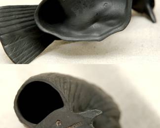 Another view of the Wedgwood black basalt model of a blackbird circa 1920 modeled by Ernest Light, with applied glass eyes, finely modeled details to the feathers, standing on a shaped base, and a Wedgewood black basalt model of a heron, also by Ernest Light