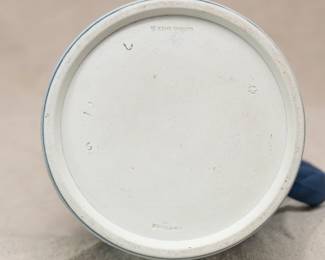 Closeup of the Wedgewood blue dip jasperware pitcher with rope handle, decorated with in white relief with classical figures beneath a band of fruiting grape vines