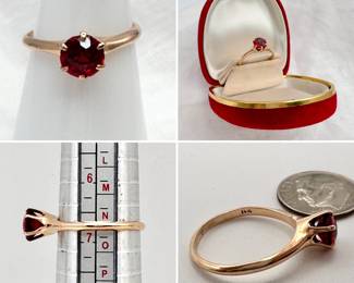 An antique garnet doublet solitaire ring set in 14-karat yellow gold.