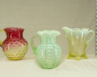 Three uranium glass pitchers in Rubina glass, pulled feather patter, and opaline glass