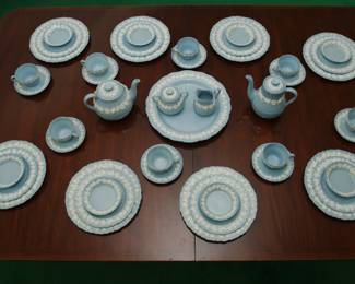 A group of Wedgwood Embossed Queensware white vine on blue shell edge china, service for eight, also includes coffee pot, tea pot, creamer and sugar