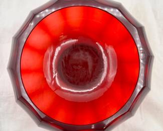 Another view of the Chinese Peking Glass ruby red bowl, compressed globe form with curved, faceted sides. The base is engraved with a four-character Qianlong mark within a square.