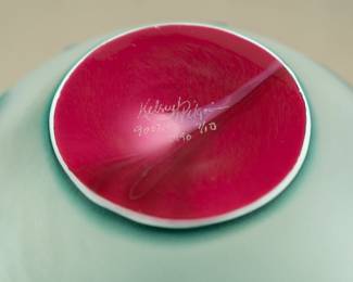 Closeup of a signed Kelsey Pilgrim cameo glass vase – visually stunning color and pattern bulbous vase, bright magenta flowers bloom with green leaves to body and at collar. Signed with artist's signature, numbered 900749, 7/10, and date of 1990. 