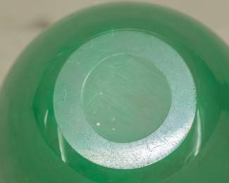 Closeup of the Monart hand blown art glass vase, green with aventurine inclusions