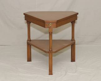 Mid century triangular end table with a lower shelf.