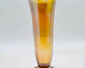 Another view of the signed Louis Comfort Tiffany favrile art glass flower vase, gold iridescent favrile glass, footed, ribbed cylindrical form with cupped mouth and wavy rim, signed in etch on base '1549' and "L. C. Tiffany - Favrile' for Tiffany Studios, first quarter 20th century; 13-1/2 inches high