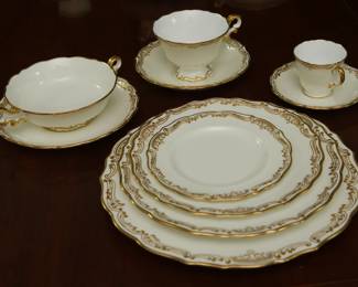 Another view of the Spode Copeland's China service for four in fine bone china, white with gold gilt scrollwork edges 
