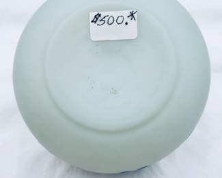 (Please note this photo includes an old price tag from when our client originally purchased the piece, and does not reflect the current sale price.) Another view of the antique Harrach or Thomas Webb & Sons cameo glass vase circa 1890, cased blue over creamy white, cameo cut around the body with flowering petals on leafy vines. A banded blue rim at the top and a polished pontil on the base.