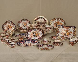 A group of 18th and 19th century Crown Derby Imari 'Kings' pattern porcelain, including tea cups and coffee cups with saucers, teapot, coffee cups, footed large serving platter/lazy susan, lidded sauceboat with tray, creamer, sugar, serving bowls and platters, and a footed compote or fruit stand