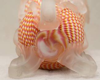 Closeup view of the astounding 12-inch-tall  Welz "zipper" art glass vase, white ground with rose and amber decoration, applied frosted feet that wrap upward in tendrils around the body, applied frosted edge to the crimped rim. First half 20th century.