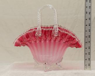 A truly amazing antique art glass basket, 11.5 tall, with clear glass twisted rope handles attached to the cranberry to clear basket that also has a pulled feather pattern in it; a band of hobnail texture below the double crimped rim and resting atop four clear glass feet. Likely a Stourbridge / Stevens & William piece.