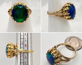 A lovely black opal triplet ring set in 18-karat yellow gold, the interior marked "18 Ct" indicating an Australian or other commonwealth country of origin.