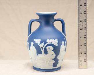 A Wedgwood blue jasper dip version of Josiah Wedgwood's Portland vase, c. 1900. Decorated with a white sprig frieze representing the myth of Peleus and Thetis.