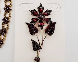 An antique rose cut garnet brooch in flower form