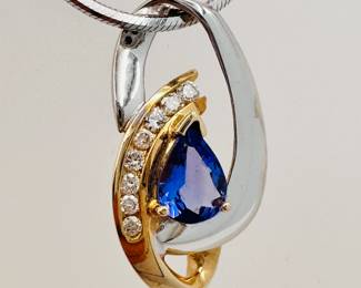 Closeup of the 14k yellow and white gold diamond and tanzanite pendant necklace with white gold chain