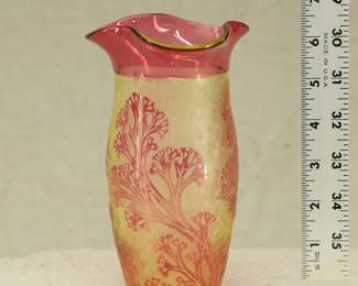 A 19th century Val St Lambert cameo art glass vase, cased uranium glass, with a three-lobed rim; cranberry glass outer layer acid-etched to create a graceful seaweed decoration. Produced around 1897.