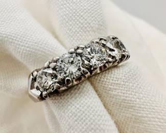 Closeup view of the platinum and diamond ring, in original C. D. Peacock Chicago presentation box