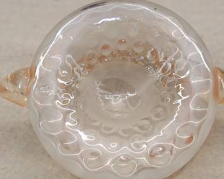 Closeup of the antique hand blown glass two-handled vase