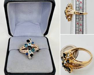 14k yellow gold ring with diamonds and varying shades of blue sapphires