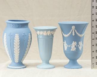 Three Wedgwood vases, two are light blue (lavender) jasperware and one is an Embossed Queen's Ware vase that is marked with impressed WEDGWOOD stamp and a circular overglaze stamp saying  Wedgwood & Barlaston of Etruria Made in England Embossed Queen's Ware, and a G stamp for 1904.