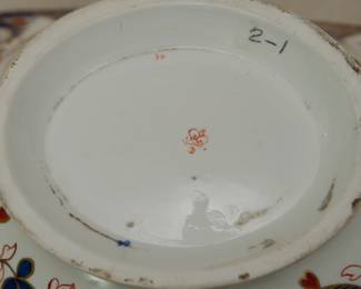 Closeup of a the Crown Derby porcelain fruit stand of footed rectangular shape with two foliate scroll handles that are marked for Crown Derby, Imari, "Kings" pattern,  circa 1806-1825. 