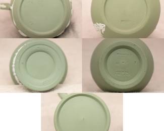 View of the bases of the group of Wedgwood sage green jasperware pitchers and vases, 20th century.