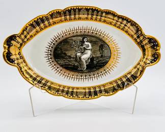 The stand or underplate from the Worcester Porcelain (Flight) lidded sauce tureen with stand from the ‘Hope service’ circa 1792, signed with blue crowned script Flight and open crescent marks, painted by John Pennington. The celebrated 'Hope' service was commissioned by the Duke of Clarence and St Andrews (later King William IV), in January 1790, and was completed just over a year later.