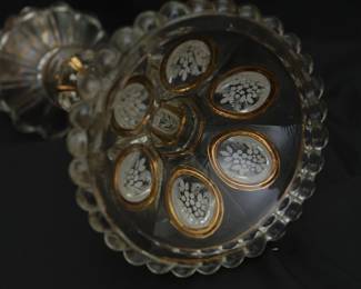 Closeup of the pair of antique French Baccarat crystal medallion pattern white enameled and gilded candlestick holders