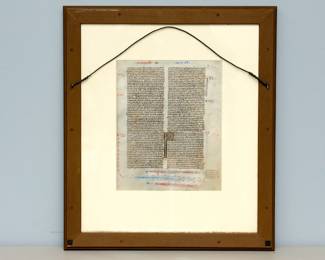 Reverse view of the framed leaf from a Bible produced in the manner of William de Brailles workshop, Oxford, circa 1230-1240. Timothy leaf with fine gold initials and herringbone feathers emerging from the mouth of dragons.