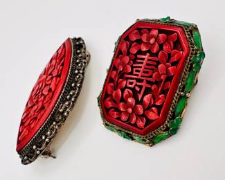 Another view of the two vintage Chinese carved cinnabar brooches