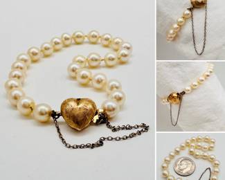 A vintage cultured pearl bracelet with safety chain and 14k yellow gold heart-shaped clasp