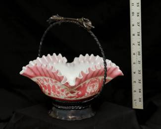 Another view of the antique bride's basket with cameo glass bowl of pink and white cased glass, square form with floral motif and flared ruffled edge; and silver plated metal basket handle stand by Rockford Silver Co. Illinois