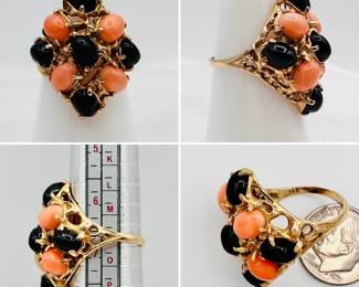 A lovely cluster ring comprised of coral and onyx cabochons set in 14-karat yellow gold, c. 1960's or 1970's.
