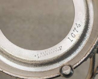 Closeup of the antique frosted art glass jam jar with Reed & Barton silver plated lid and stand