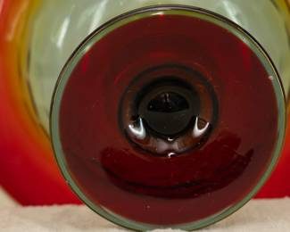 Closeup of the fabulous Art Deco period console set by Cambridge Glass circa 1920s-1930s, comprised of a Honeycomb pattern footed bowl in Rubina glass with a matching pair of candlesticks. 