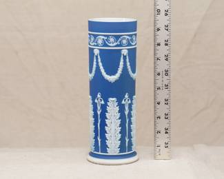 A 19th century Wedgwood blue jasper dip cylindrical vase, with applied with acanthus leaves below rams masks and foliate swags; 9-1/2 inches high.